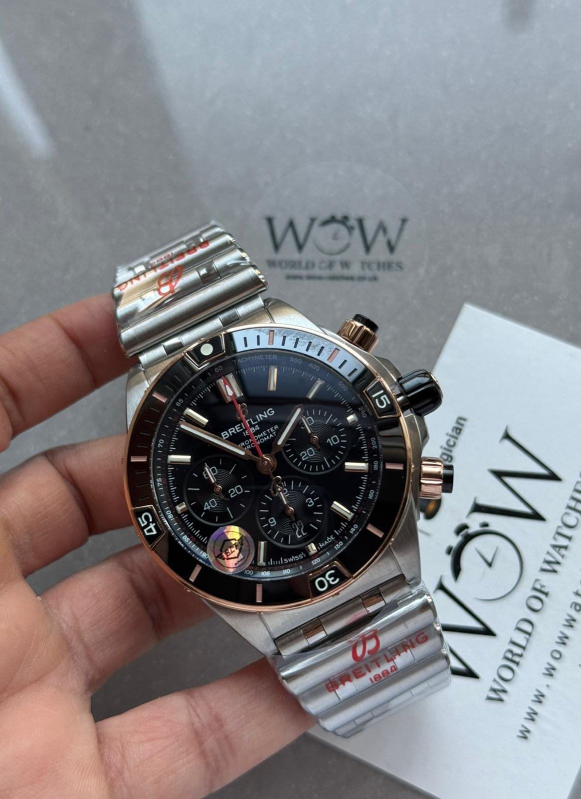 Chronomat B01 42mm BLS Best Edition Two Tone Rose Gold Bezel Black Dial on SS Rouleaux Bracelet A7750